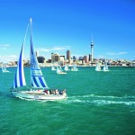 Sailing boat with Auckland cityscape
